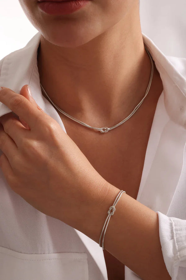 Dainty Silver Knot Necklace – A Timeless Symbol of Connection and Strength